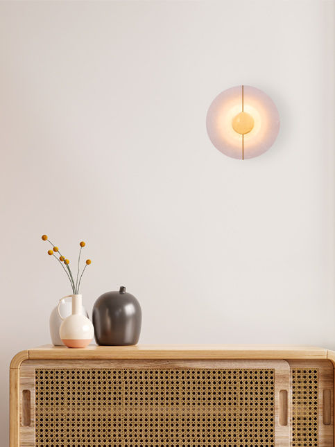 Minimal wall light above wooden console with decor accents – Beautiful Homes