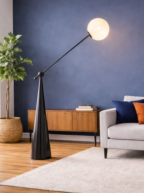 Modern living room with floor lamp against blue accent wall – Beautiful Homes