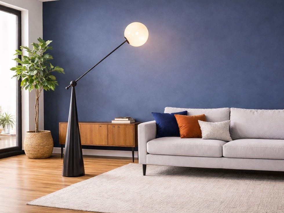 Modern living room with floor lamp against blue accent wall – Beautiful Homes