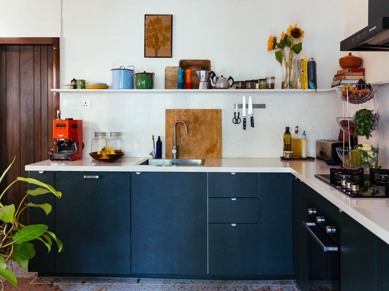 The collected pieces sitting on the open shelves lend pops of colour to the kitchen – Beautiful Homes