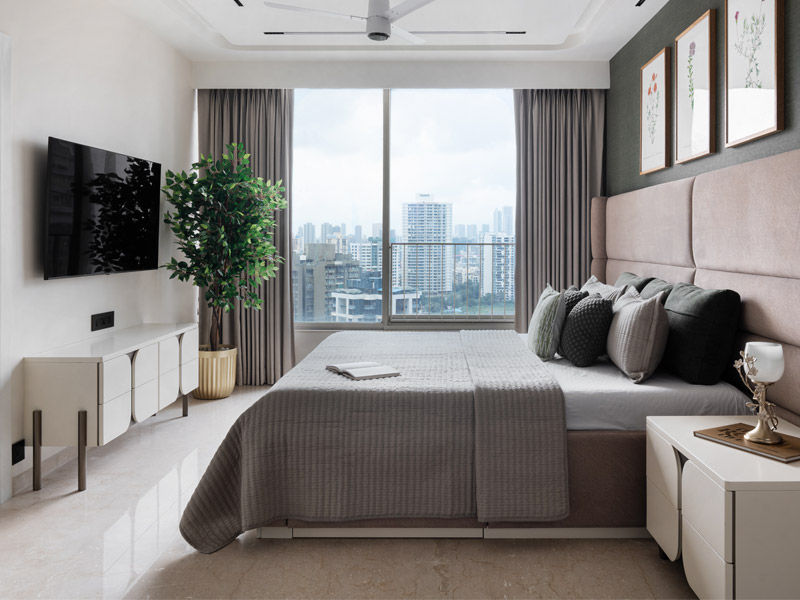Modern bedroom with neutral tones and city view window – Beautiful Homes