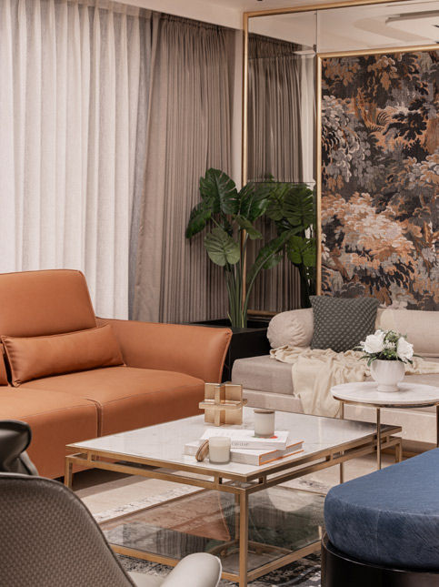 Modern living room with orange sofa and marble coffee table – Beautiful Homes