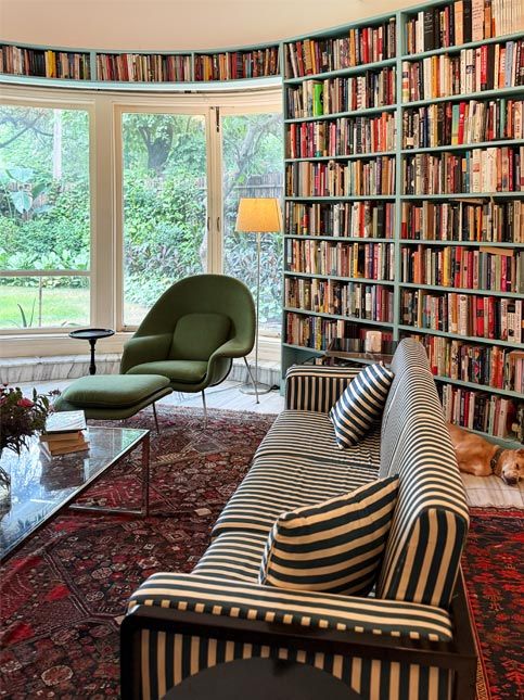 Bright home library with large windows and bookshelves – Beautiful Homes