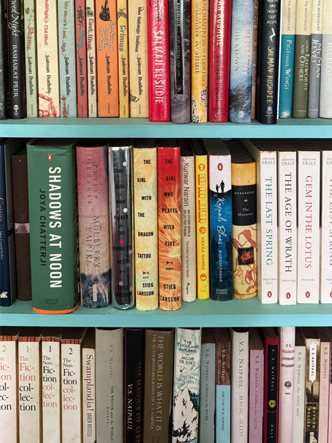 Colourful bookshelf with modern and classic books – Beautiful Homes
