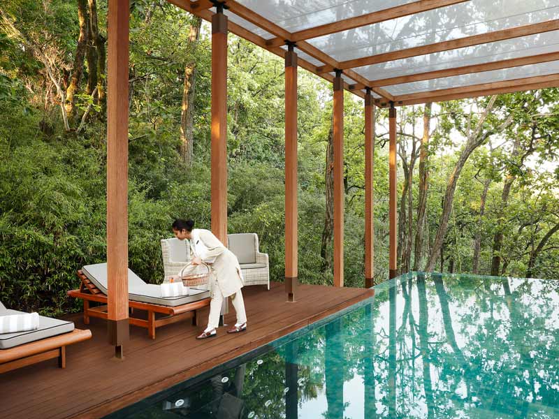 A private villa at Ananda opens onto forested Himalayan views, where personal butlers, yoga sessions, and spa rituals shape a deeply restorative stay – Beautiful Homes