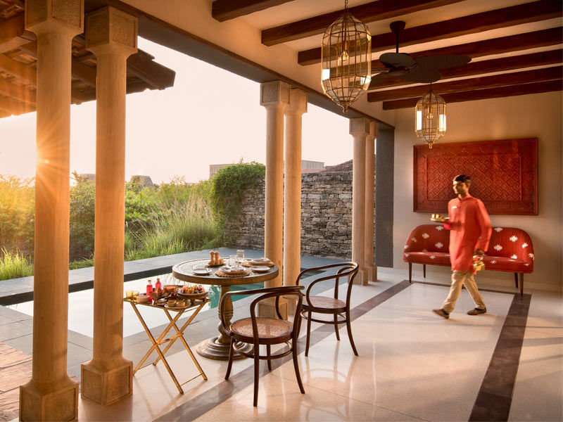 Stone pathways and lantern-lit courtyards at Aramness Gir set the tone for a wilderness retreat – Beautiful Homes