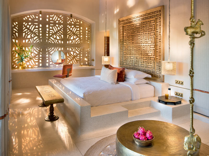 Warm stone, carved screens, and handcrafted brass details create a sanctuary that reflects the rustic elegance of Gujarat’s Gir landscape – Beautiful Homes