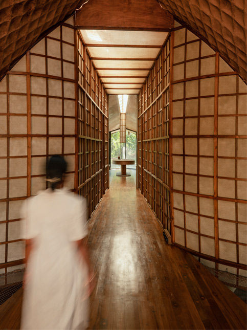 Wooden corridor with textured walls and natural light – Beautiful Homes