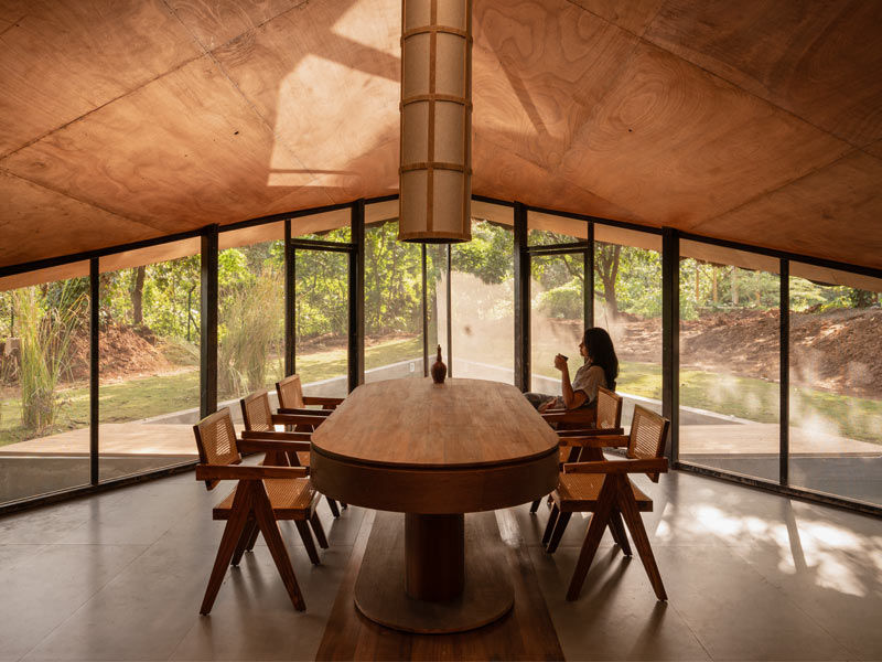 Wooden dining space with glass walls and nature view – Beautiful Homes