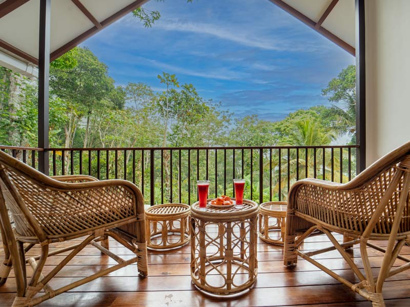 Rattan seating on forest balcony – Beautiful Homes