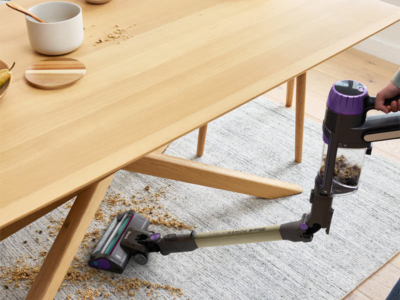 Shark PowerDetect cordless vacuum cleaning under wooden dining table – Beautiful Homes