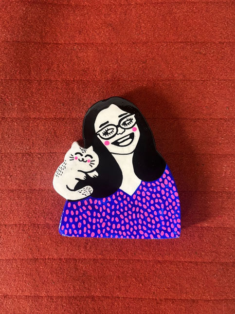Graphic clay portrait with playful everyday details – Beautiful Homes