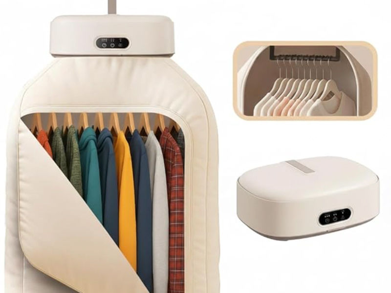 A compact, cream-colored portable clothes drying pod used for hanging and drying garments in small spaces – Beautiful Homes