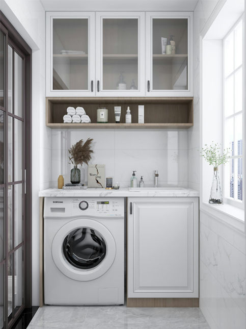 A neatly organized utility area featuring a front-load washing machine, sink, and overhead cabinets – Beautiful Homes