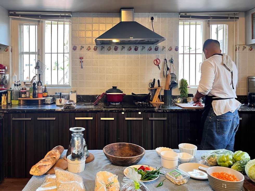 Chef preparing meal in modern kitchen – Beautiful Homes