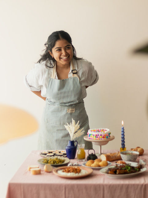 Woman serving food at dining table – Beautiful Homes