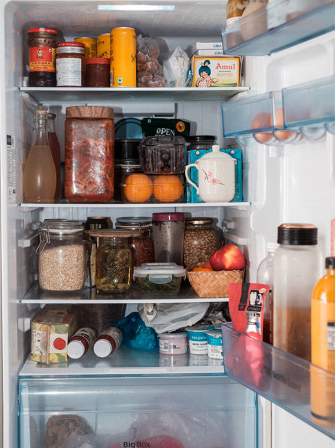 Open refrigerator filled with food and jars – Beautiful Homes