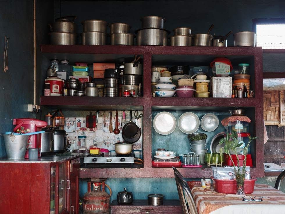 Neatly organized kitchen shelves with cookware and crockery – Beautiful Homes