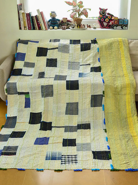 Colourful patchwork quilt draped on sofa – Beautiful Homes