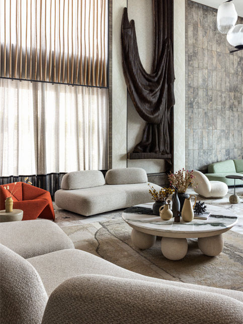 Modern living room with marble coffee table and textured wall art – Beautiful Homes