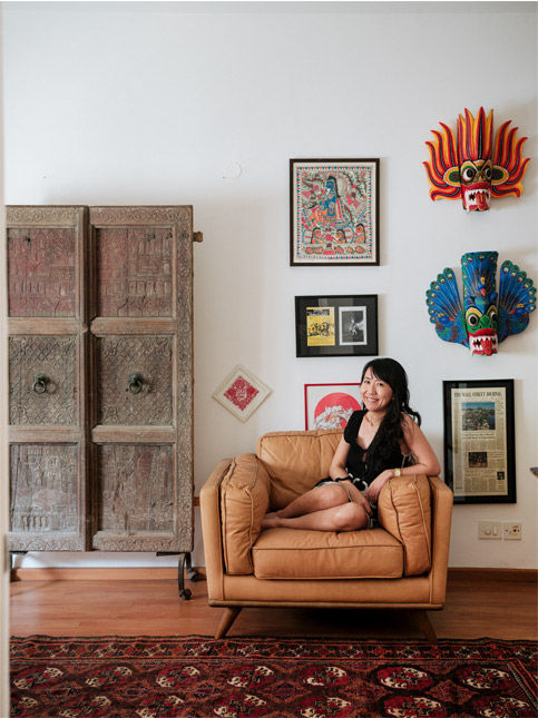 Rajasthani carved wood door and painted Sri Lankan masks - Beautiful Homes