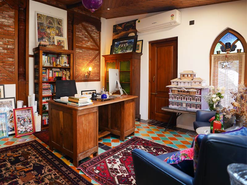 Reclaimed Kashmiri windows and Dhaji Diwari wall in studio - Beautiful Homes