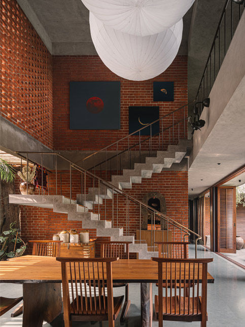 Hilla House by Studio Lagom with pendant lights and celestial wall art - Beautiful Homes