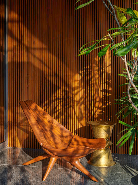 Studio Lagom interior with Anantaya side table and Red Blue Yellow chair - Beautiful Homes