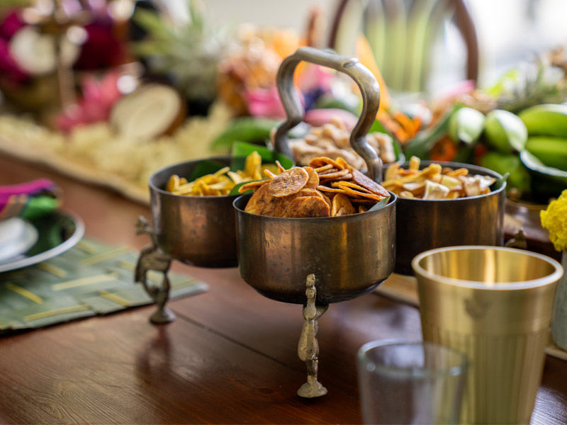 Nendran banana and chakka jackfruit chips served in a traditional brass caddy - Beautiful Homes