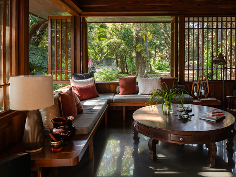 Copper House II corner bench overlooking lush landscape - Beautiful Homes