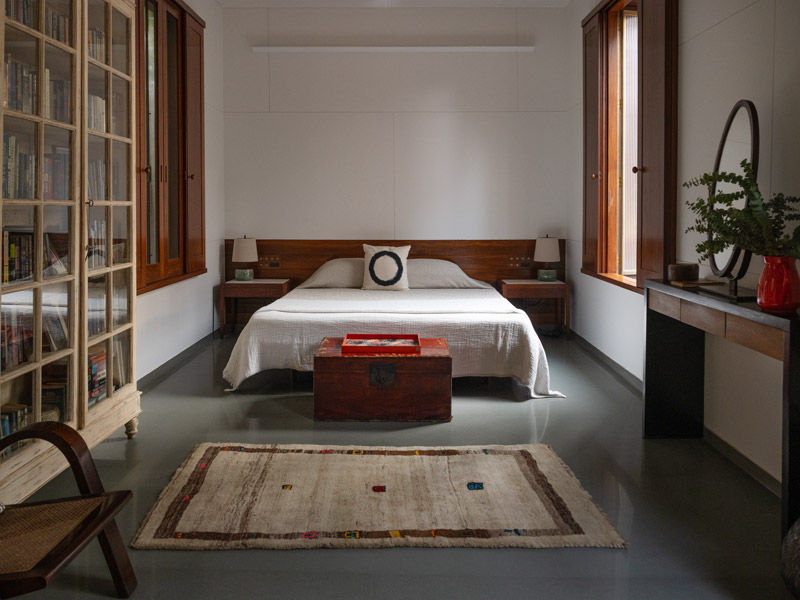 Copper House II first-floor guest bedroom with Kota stone flooring - Beautiful Homes