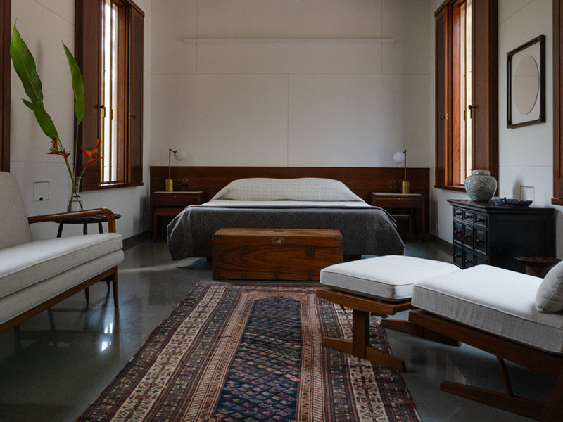 Copper House II master bedroom with restored architectural elements - Beautiful Homes