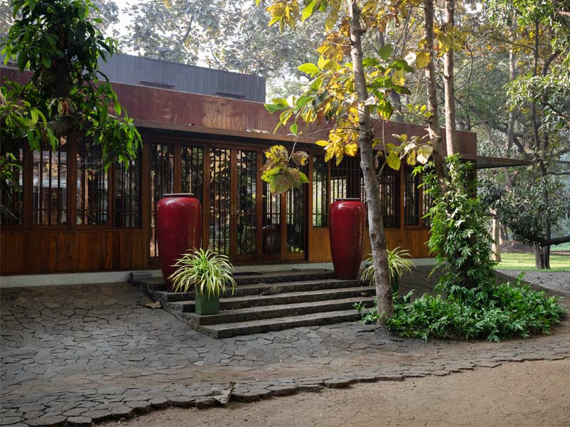 Copper House II opening to landscape with raised basalt plinth - Beautiful Homes
