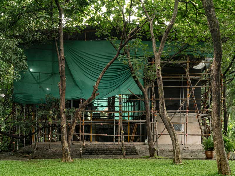 Copper House II restoration wrapped in protective tarpaulins - Beautiful Homes