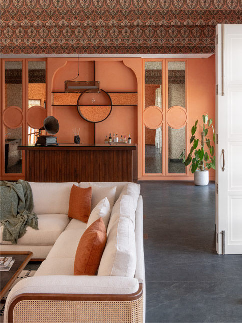 The home theatre lounge in a Raipur-based residential project designed by BASICS Studio features wall texture and ceiling wallcovering from Nilaya by Asian paints, and sofa from Lifestyle furnishings – Beautiful Homes