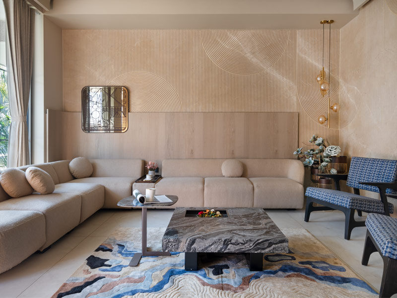 Beige drawing room with marble flooring and colourful upholstery - Beautiful Homes