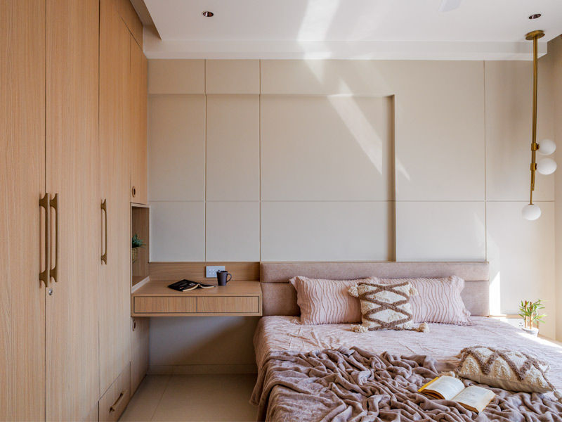 Clutter-free guest bedroom with cabinetry and floating desk - Beautiful Homes