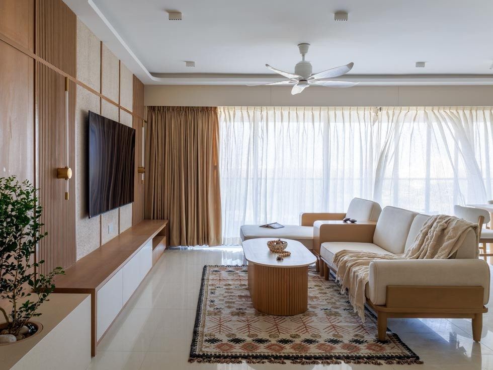 Scandinavian living room with teakwood sofa and wooden louvers - Beautiful Homes