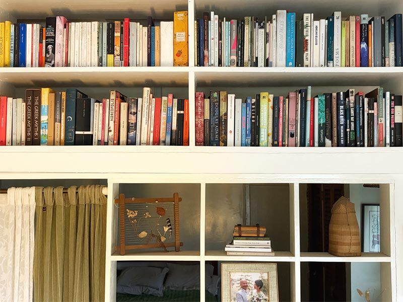 Janice Pariat bookshelves with no system in Shillong home - Beautiful Homes