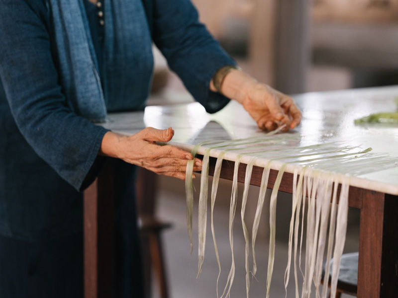 Banana fibres aligned on table for making yarn - Beautiful Homes
