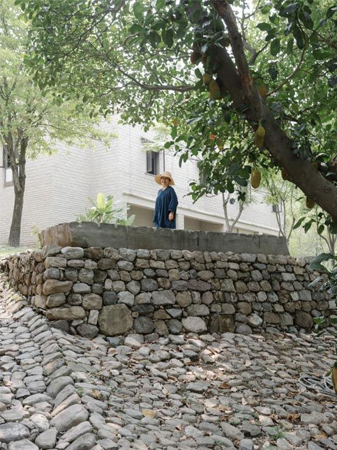 Chiaki Maki standing in her farm at Ganga Maki - Beautiful Homes