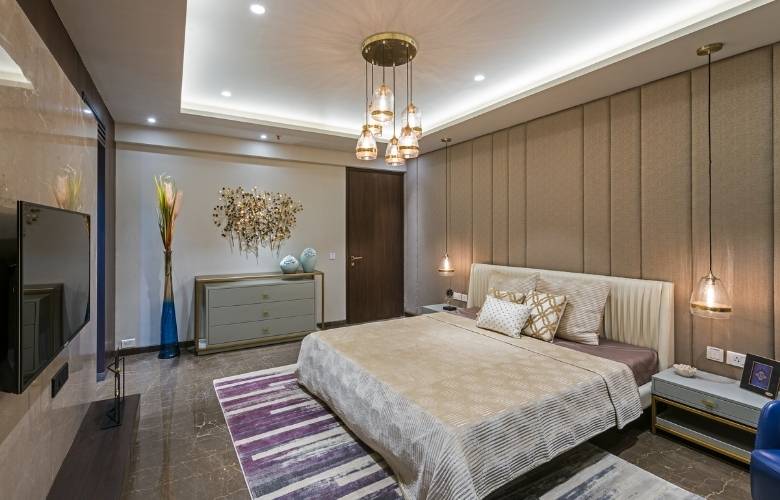 Bedroom decoration items like pendant lights, wall statement art & area rug - Beautiful Homes