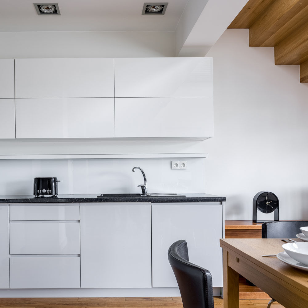Minimalist modular kitchen design with the black countertop - Beautiful Homes