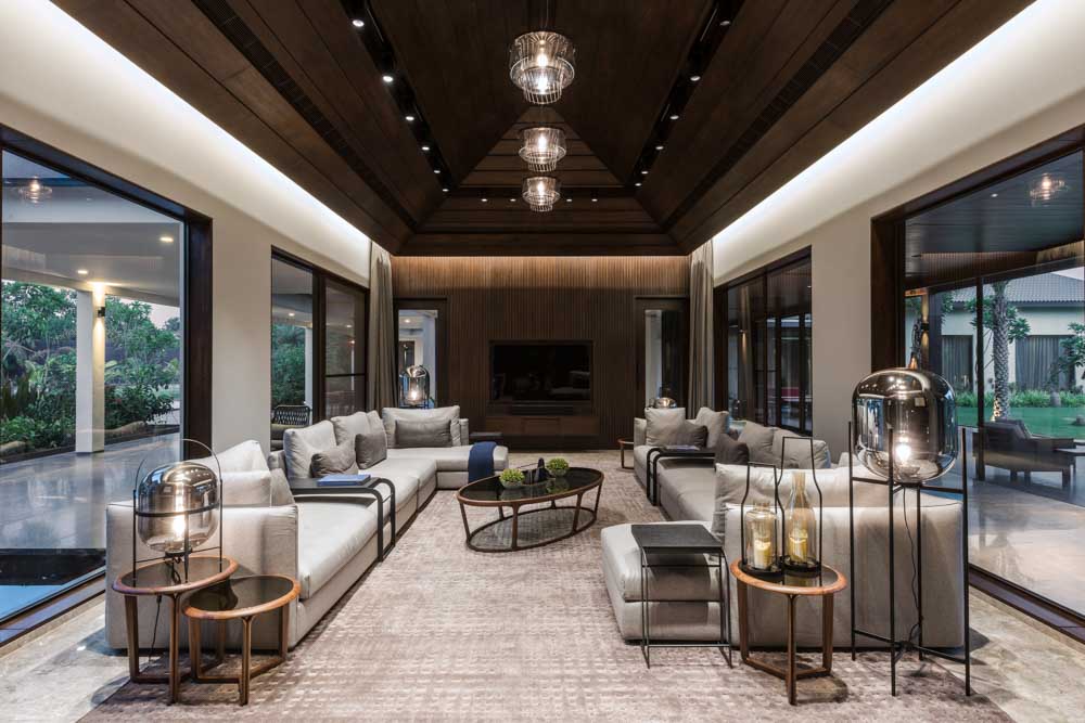 Glass wall & doors design with the dark wood false ceiling  - Beautiful Homes
