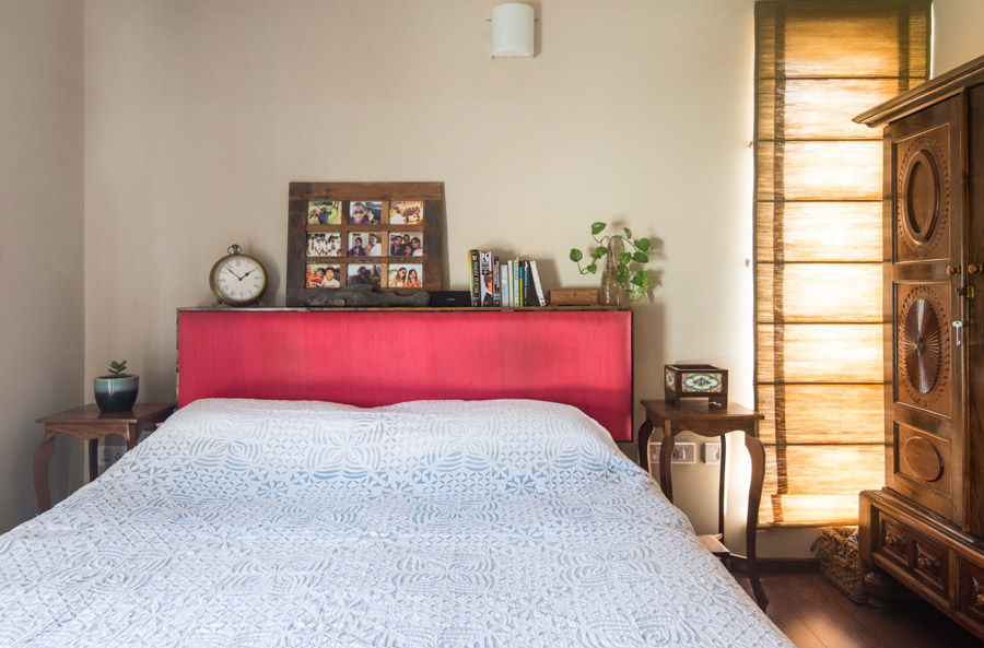Applique work on white bedspread in bedroom interiors with minimal décor and white walls - Beautiful Homes