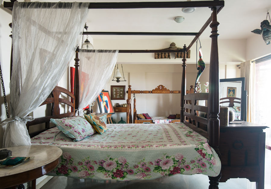 Bold bedroom décor ideas &  statements as a temple wooden panel and a marble-topped table in an Indian bedroom design full of history - Beautiful Homes