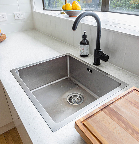 Modern kitchen sink design with a curved faucet - Beautiful Homes