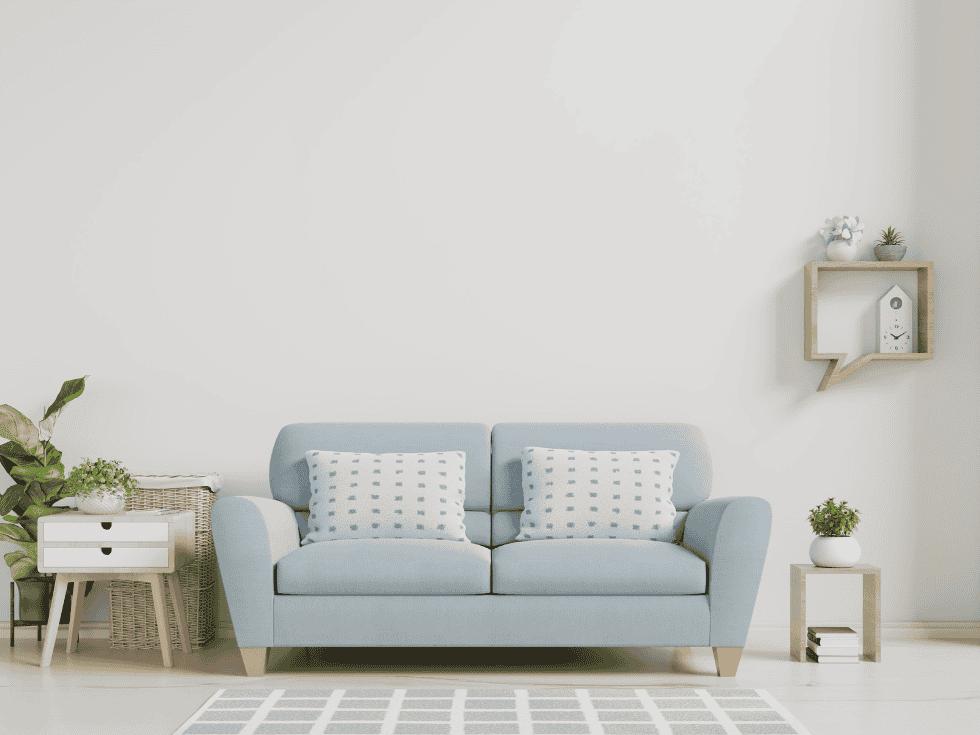 Light Blue Sofa With Patterned Cushions And Side Tables - Beautiful Homes