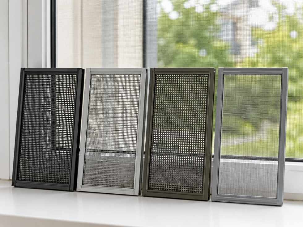 Different mosquito mesh materials displayed in framed samples for uPVC windows - Beautiful Homes