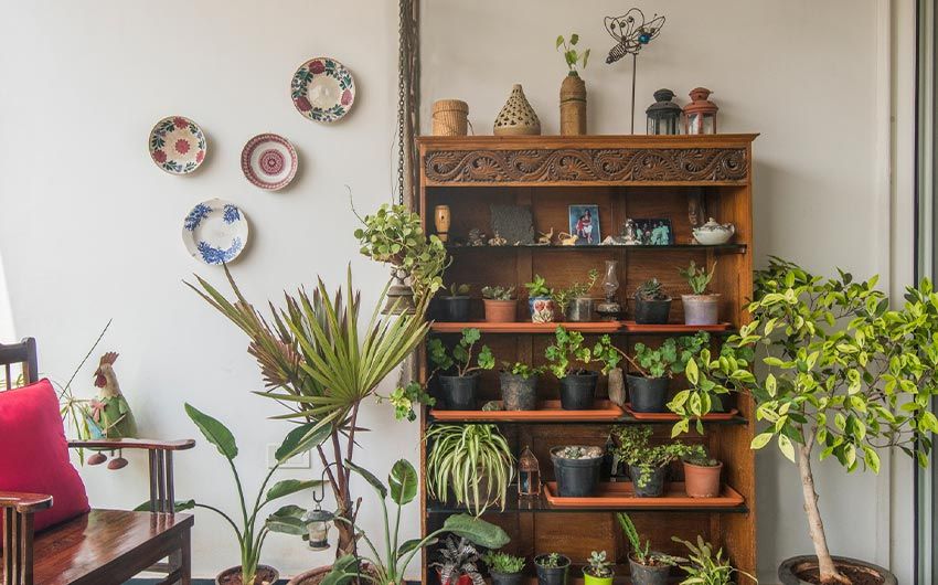 Garden ideas for small balcony with wall décor & rocking chair - Beautiful Homes